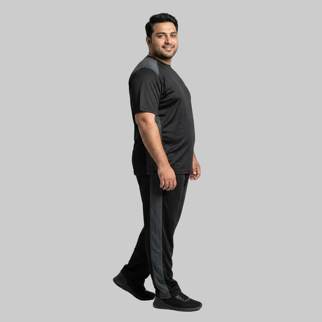 Men's Black & Grey Polyester Co-Ord Set featuring a crewneck T-shirt and matching trousers made from breathable mesh polyester fabric with grey contrast panels.