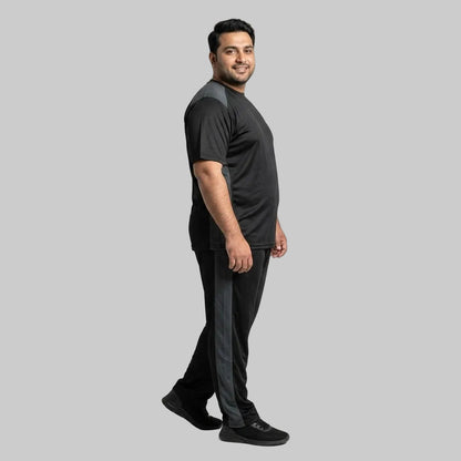 Men's Black & Grey Polyester Co-Ord Set featuring a crewneck T-shirt and matching trousers made from breathable mesh polyester fabric with grey contrast panels.
