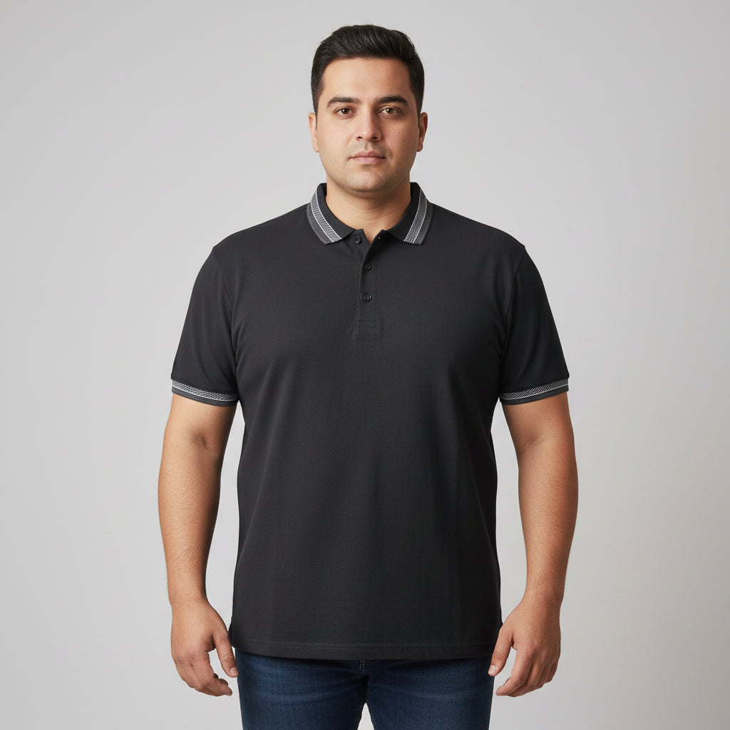 Black plus size polo shirt with grey striped collar and sleeve cuffs front view laid flat.
