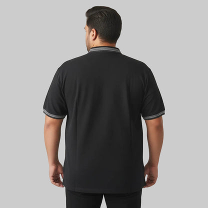 Black plus size polo shirt with grey striped collar and sleeve cuffs front view laid flat.