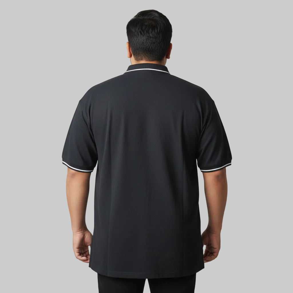 Black plus size polo shirt with white tipped collar and sleeve cuffs front view laid flat.