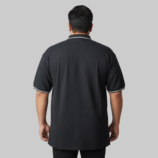 Black plus size polo shirt with white tipped collar and sleeve cuffs front view laid flat.