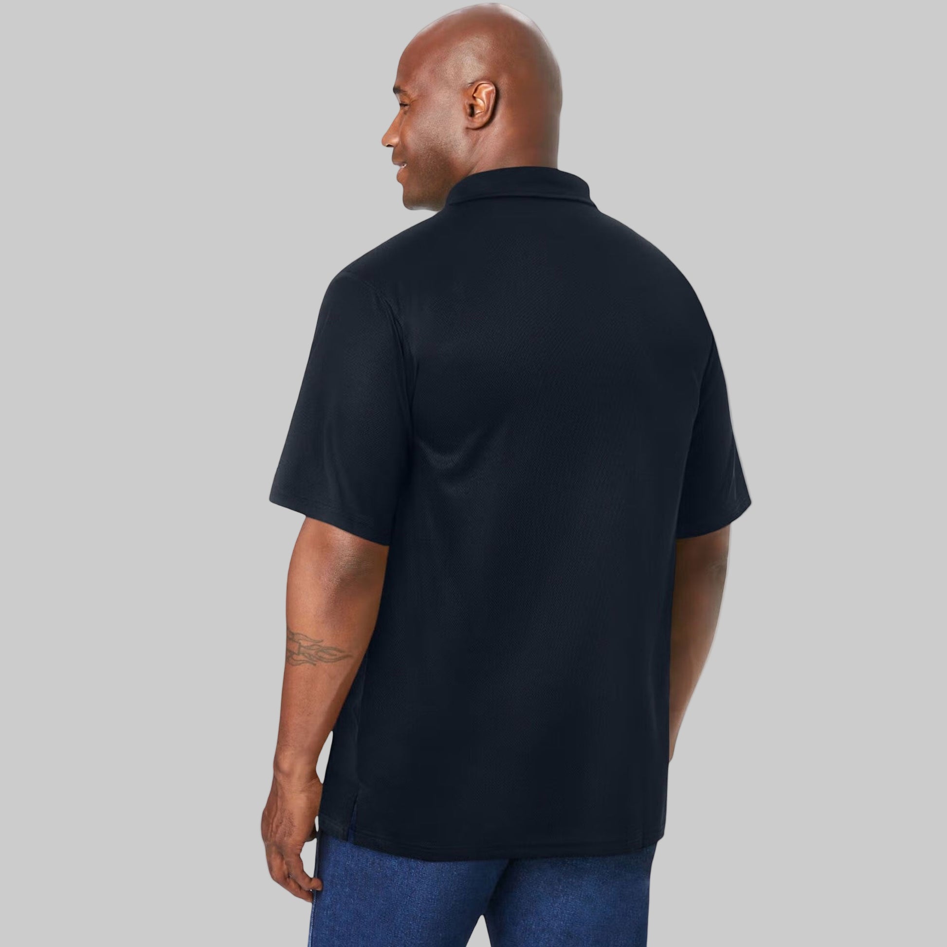 Black polyester short sleeve polo shirt with classic collar and button placket