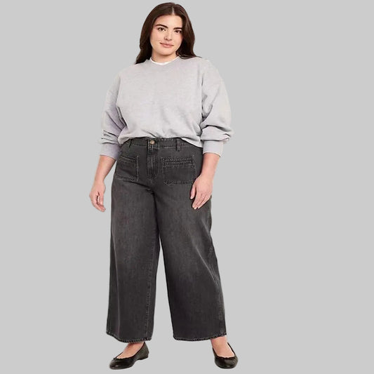 Women's black wash plus size high-waisted wide-leg denim jeans with a relaxed fit and wide-leg silhouette.