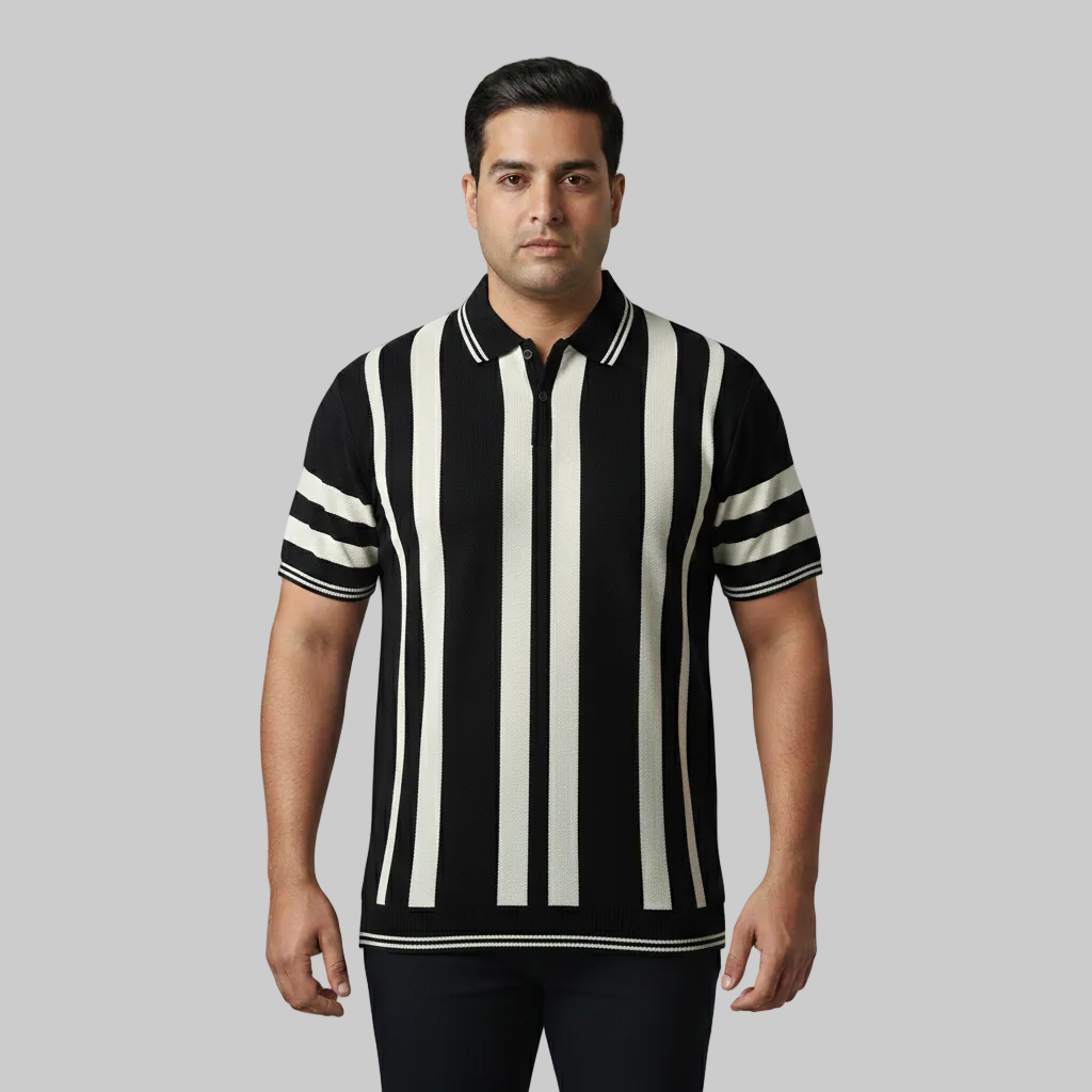 Black and white vertical stripe polo t-shirt worn by a male model, featuring a classic collar and short sleeves on a clean studio background