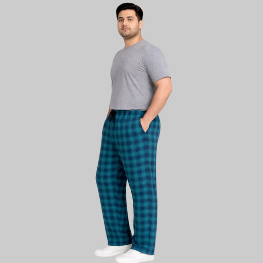 Blue plaid plus-size jersey lycra trousers with drawstring waistband, laid flat on white background