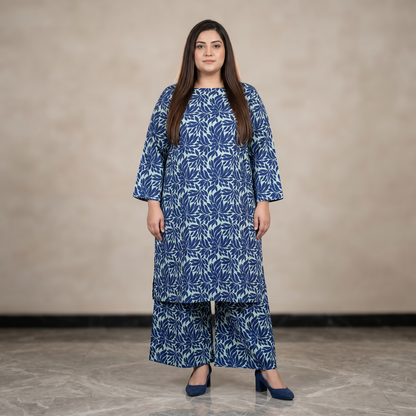 Woman wearing a blue floral patterned outfit against a beige background