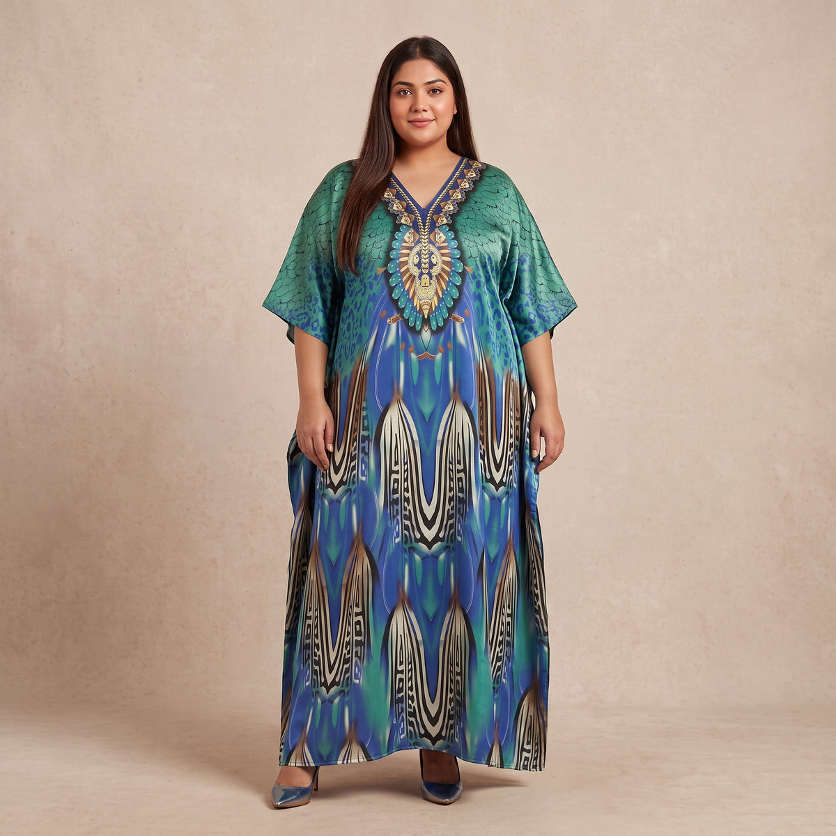 Blue and teal peacock feather motif maxi kaftan made from lightweight polyester with an elegant print and flowing silhouette.