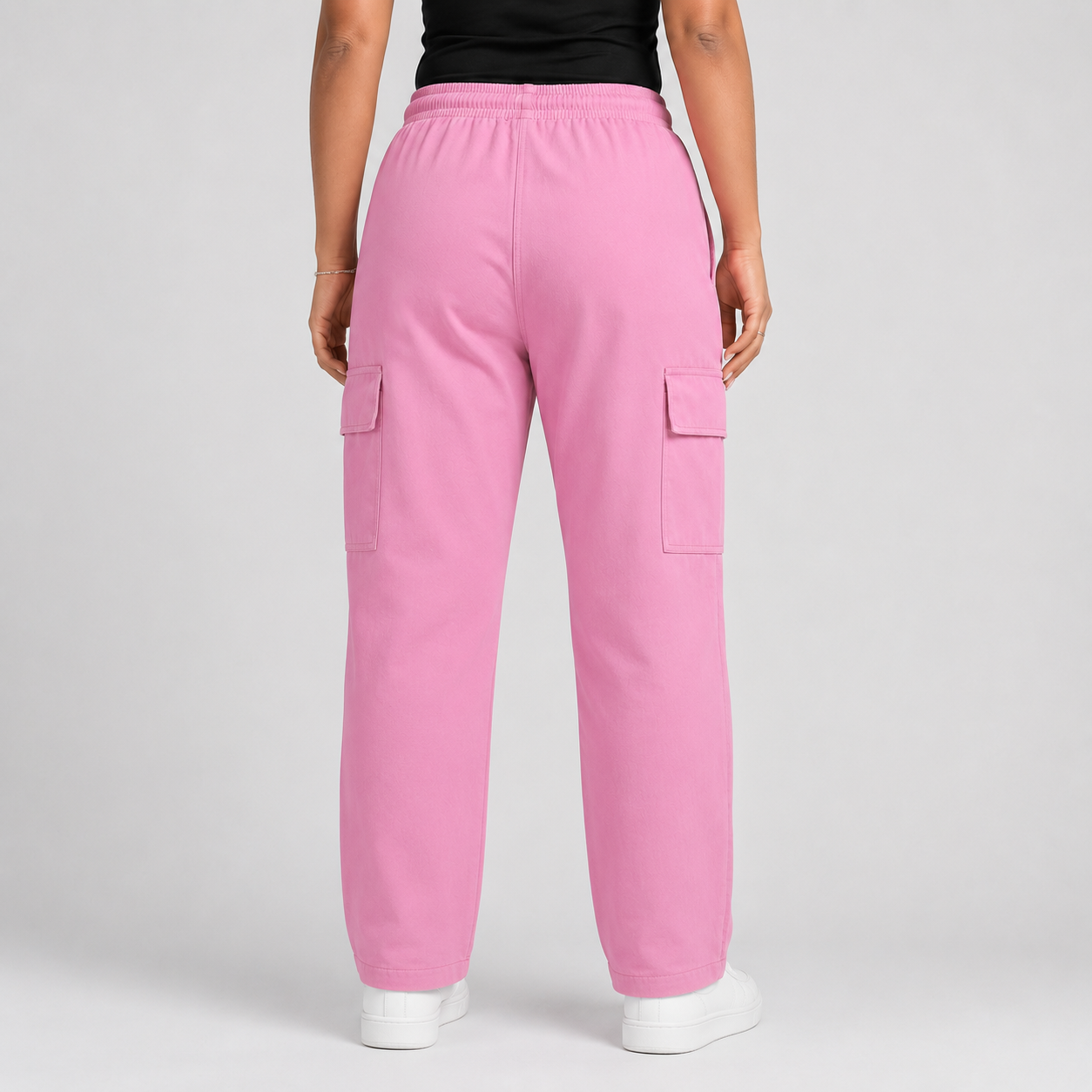 Blush Pink Cargo Baggy Trousers in premium 98% cotton, 2% elastane twill dyed fabric with relaxed baggy fit, elastic waistband, and utility cargo pockets.