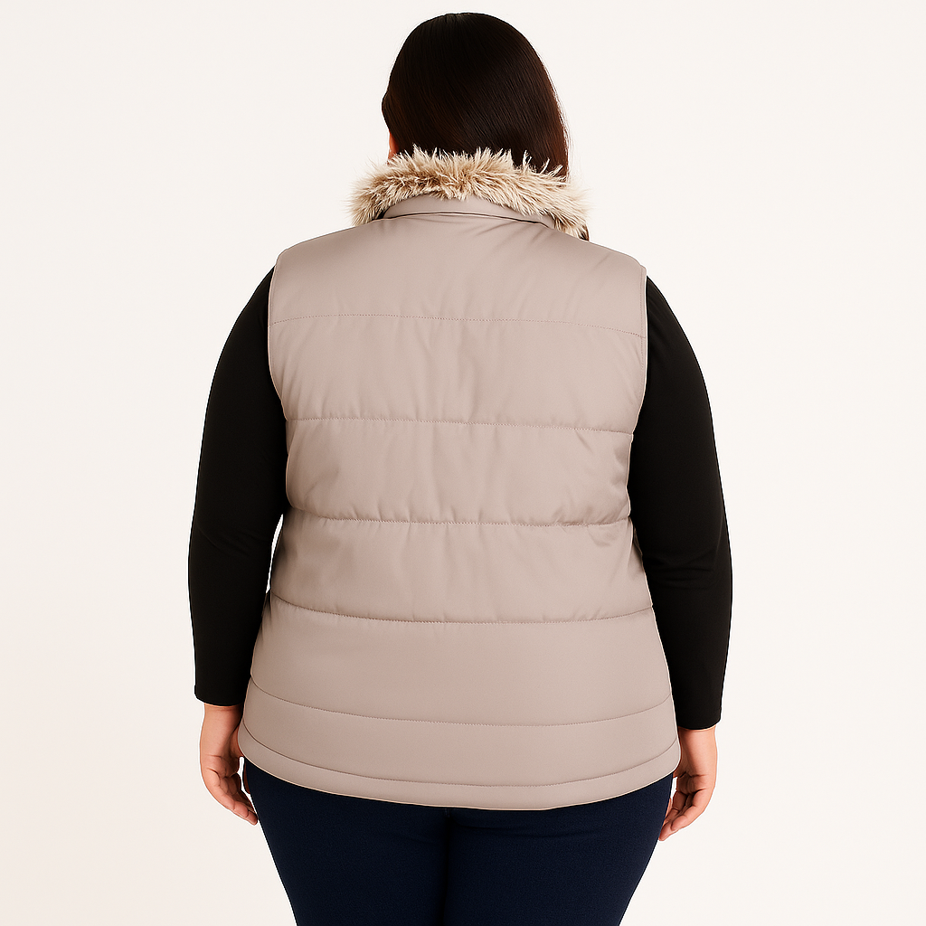 Plus size Pakistani female model wearing blush pink sleeveless puffer vest with faux fur collar, quilted padded panels, and welt pockets – winter outerwear
