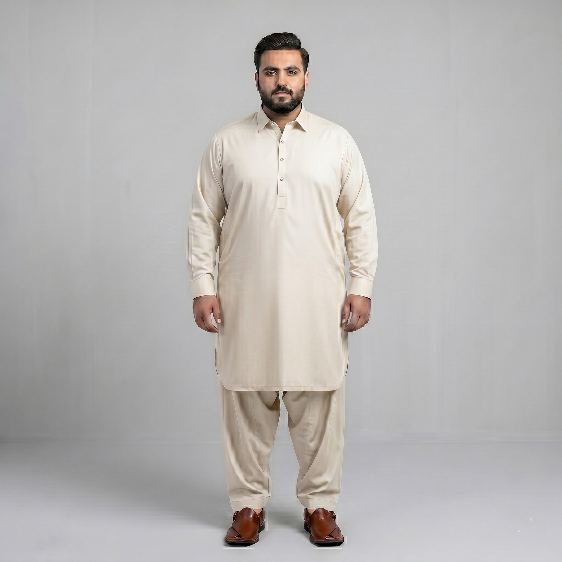 Man wearing a beige kurta set on a gray background