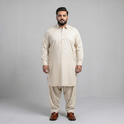 Man wearing a beige kurta set on a gray background