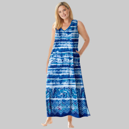Plus-size woman wearing a bright cobalt tie-dye stripe sleeveless V-neck long lounger with side pockets, photographed on a white background.