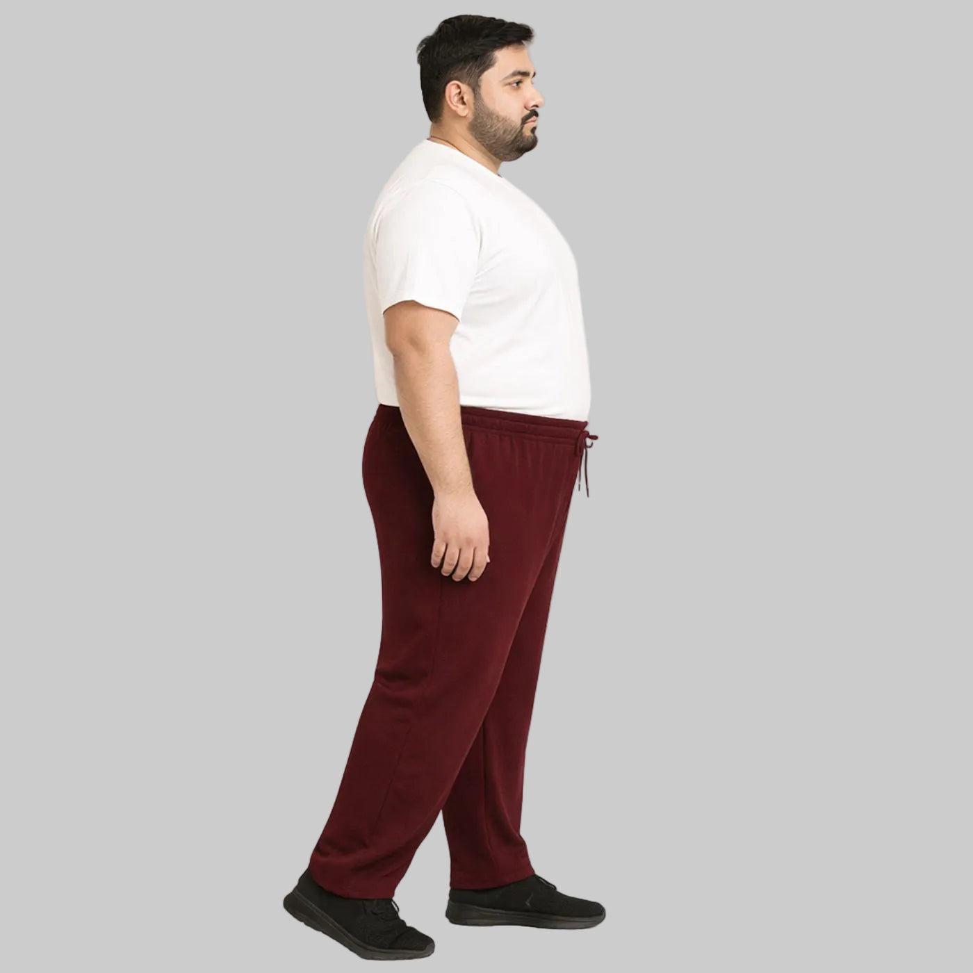 Burgundy mesh polyester plus size trouser worn by a male model, featuring breathable fabric and a comfortable relaxed fit