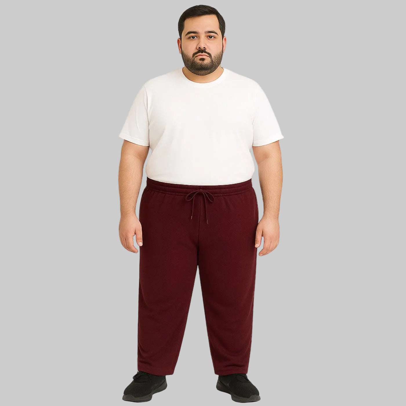 Burgundy mesh polyester plus size trouser worn by a male model, featuring breathable fabric and a comfortable relaxed fit