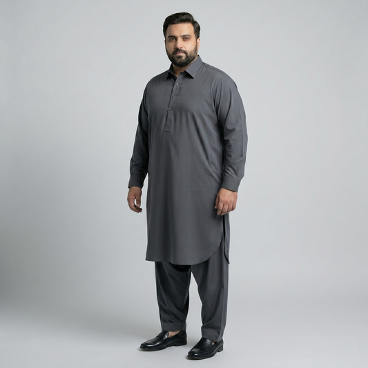 Man wearing a gray traditional outfit on a light gray background