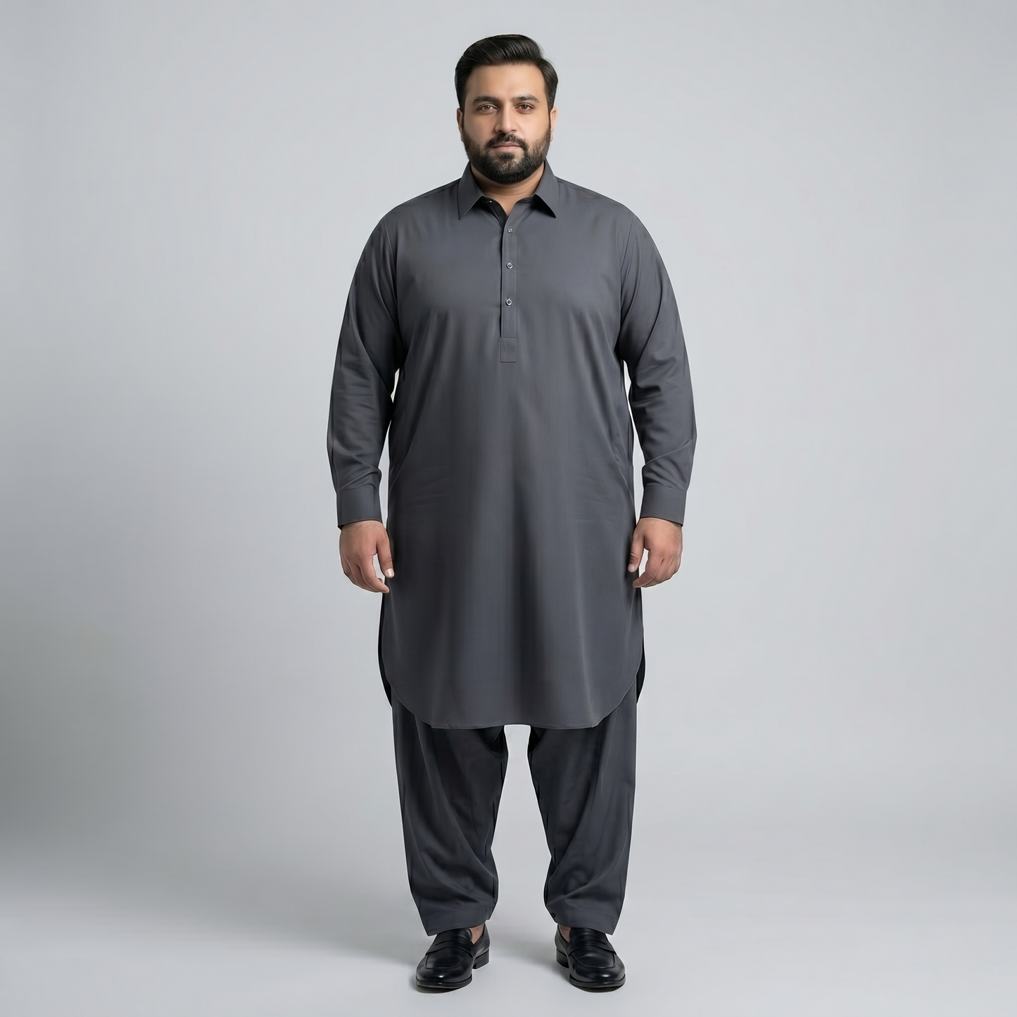 Man wearing a gray traditional outfit on a light gray background