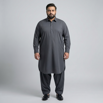 Man wearing a gray traditional outfit on a light gray background