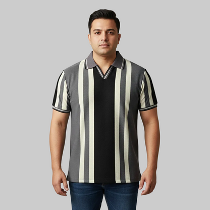 Charcoal grey and black vertical stripe polo t-shirt worn by a male model, featuring a classic collar and short sleeves on a studio background