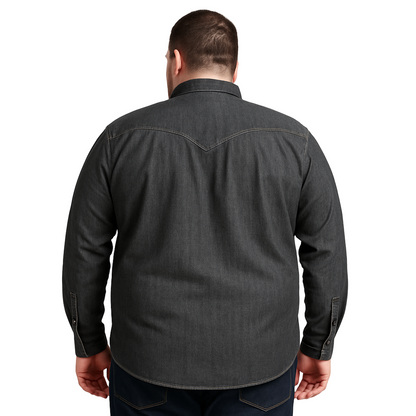 Plus-size male model wearing a charcoal denim western shirt with chest pockets, button-down front, and long sleeves, photographed in studio for e-commerce.