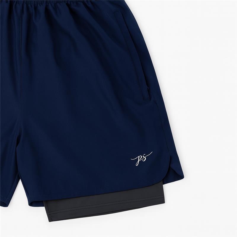 Plus-size male model wearing navy blue hybrid double-layer performance shorts with white t-shirt and sneakers