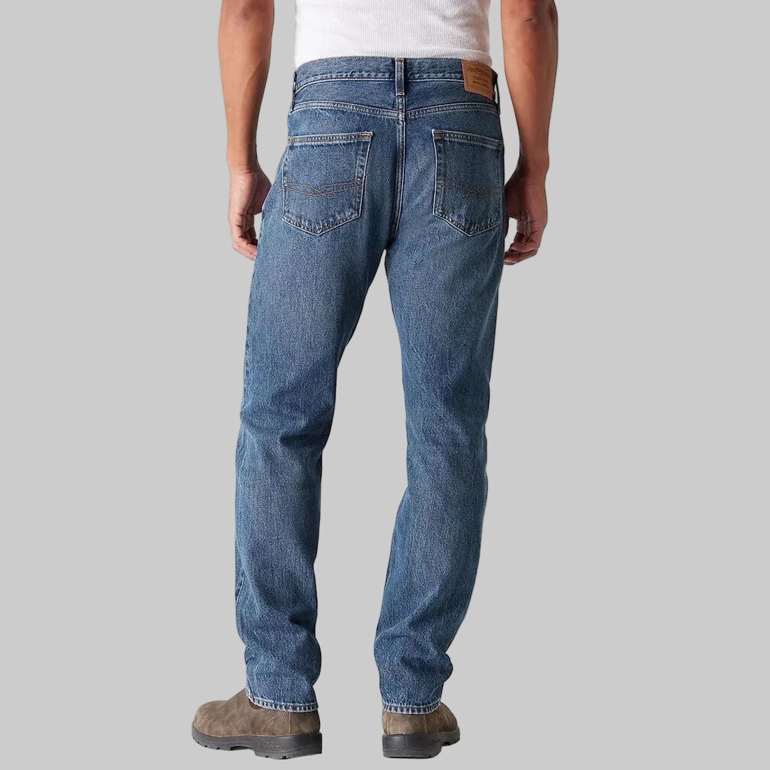Men’s classic mid blue straight fit denim jeans made from 100% cotton, front view with regular leg opening and clean five-pocket design