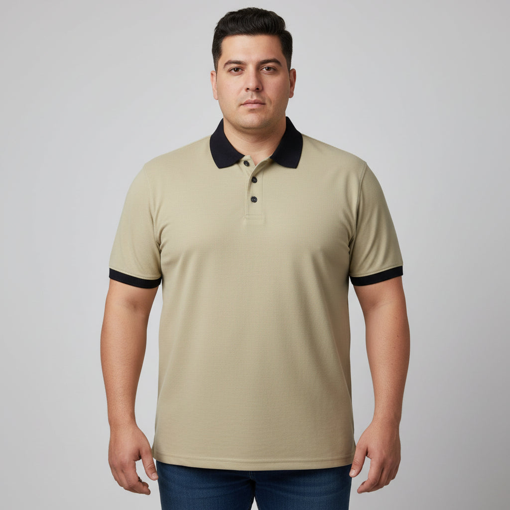 Alt Text: Men's classic beige short-sleeve polo shirt featuring a black contrast collar and ribbed sleeve trims, laid flat on a white surface.