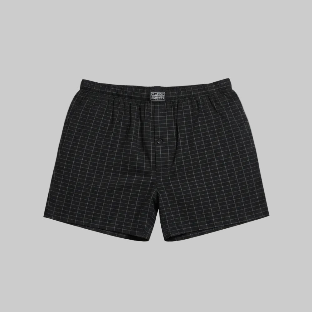 Classic black micro-check cotton boxer with elastic waistband, laid flat showing a clean and comfortable everyday design