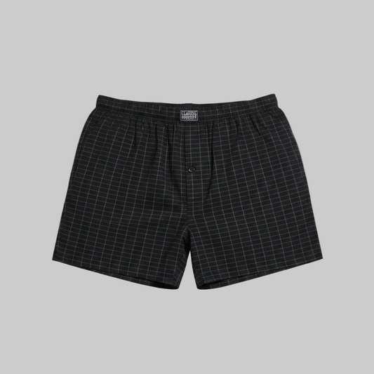 Classic black micro-check cotton boxer with elastic waistband, laid flat showing a clean and comfortable everyday design