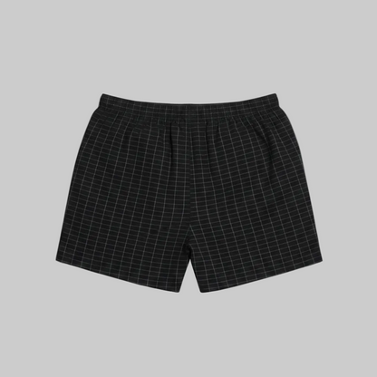Classic black micro-check cotton boxer with elastic waistband, laid flat showing a clean and comfortable everyday design