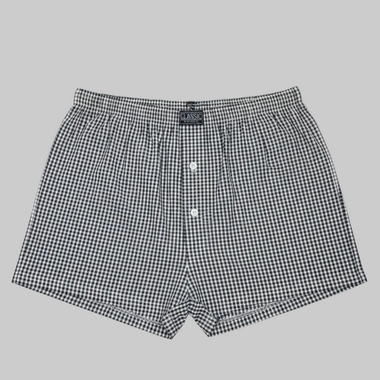 Classic black and white micro-check cotton boxer with elastic waistband and button fly, laid flat showing a clean everyday design