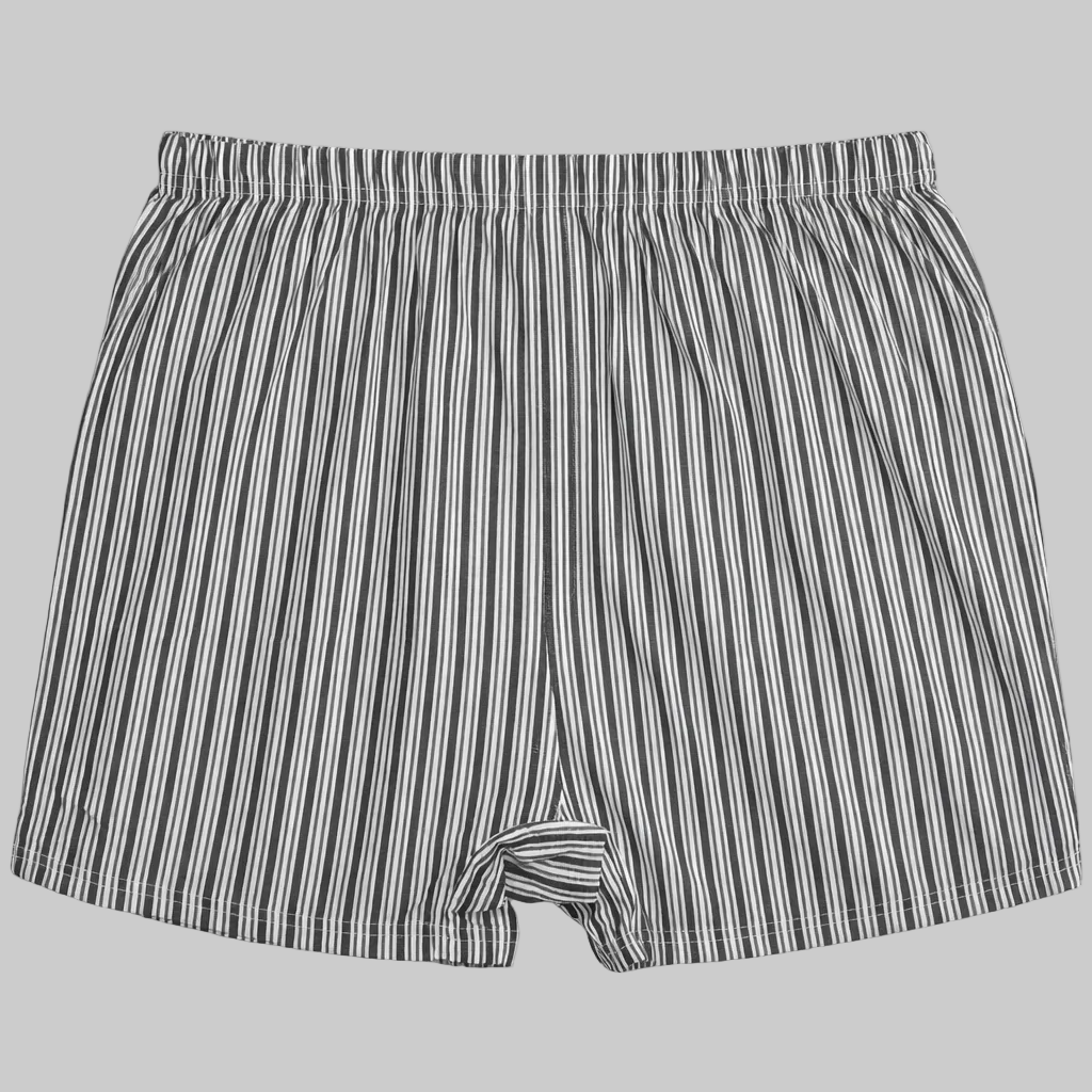 Black and white vertical stripe cotton boxer with elastic waistband and button fly laid flat on a white background