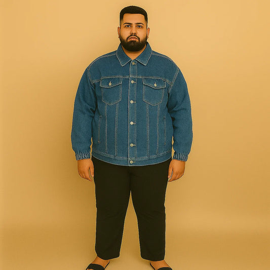 Plus-size man wearing classic blue denim jacket with elastic cuffs and chest flap pockets

