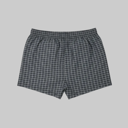 Classic charcoal micro-check cotton boxer with elastic waistband and button fly, laid flat showing a clean and comfortable everyday design