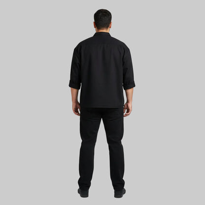 Classic jet black straight fit cotton denim jeans with button closure.