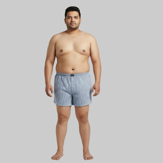 Light grey grid check cotton boxer with elastic waistband and button fly displayed on a plain white background