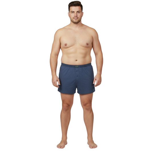 Classic navy blue cotton boxer with elastic waistband and button fly, laid flat showing a simple and comfortable everyday design