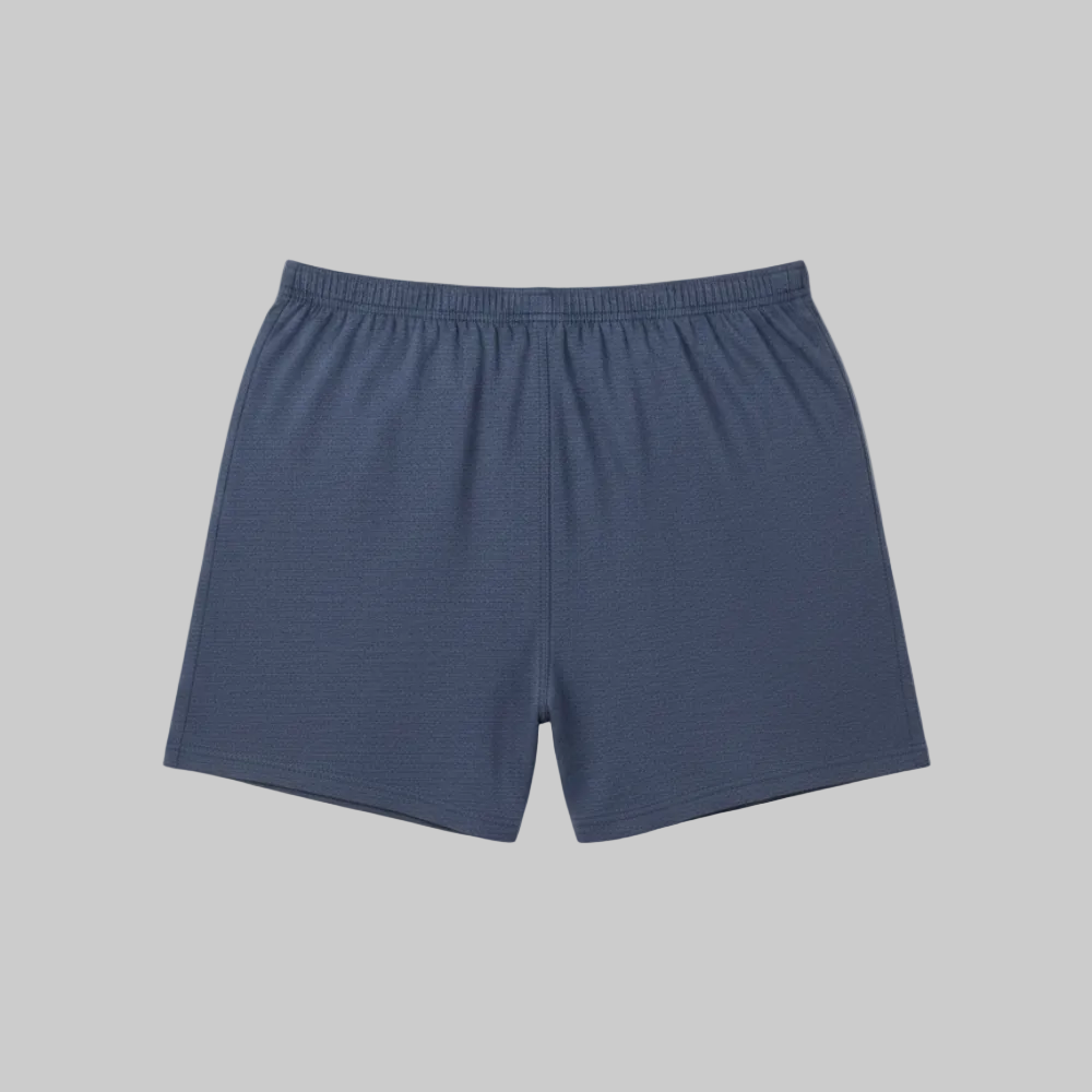 Classic navy blue cotton boxer with elastic waistband and button fly, laid flat showing a simple and comfortable everyday design