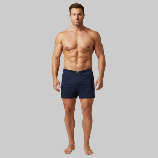 Classic navy blue plain cotton boxer with elastic waistband and button fly, laid flat showing a clean and comfortable everyday design