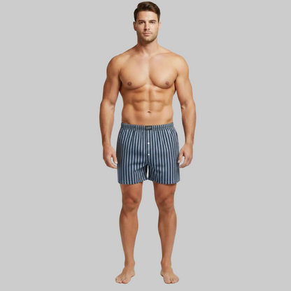 Classic navy and white vertical stripe cotton boxer with elastic waistband and button fly, laid flat showing a clean and comfortable everyday design