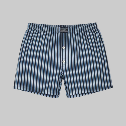 Classic navy and white vertical stripe cotton boxer with elastic waistband and button fly, laid flat showing a clean and comfortable everyday design