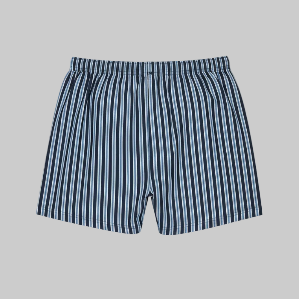 Classic navy and white vertical stripe cotton boxer with elastic waistband and button fly, laid flat showing a clean and comfortable everyday design