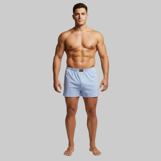 Classic sky blue plain cotton boxer with elastic waistband and button fly, laid flat showing a clean and comfortable everyday design