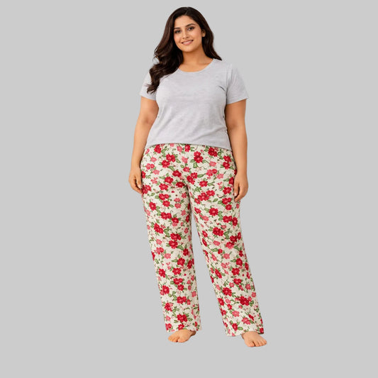 Cream flannel pajama pants with red floral print worn by 2XL model