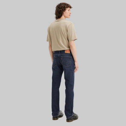 Flat lay of Dark Indigo Signature Slim Straight Jeans in dark indigo wash with high-stretch denim