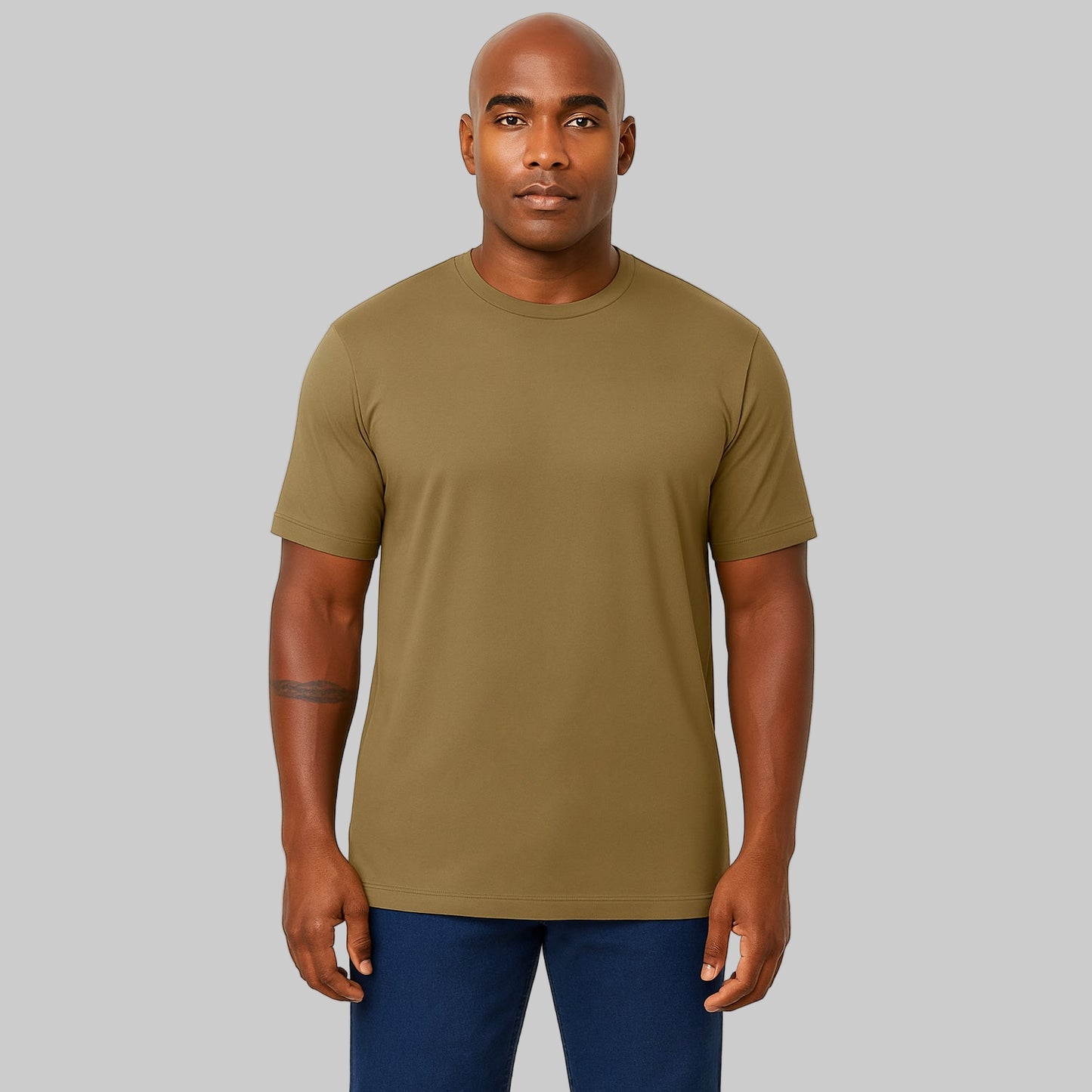 Plus-size Pakistani male model wearing dark khaki heavyweight crewneck T-shirt on a studio background, relaxed fit.