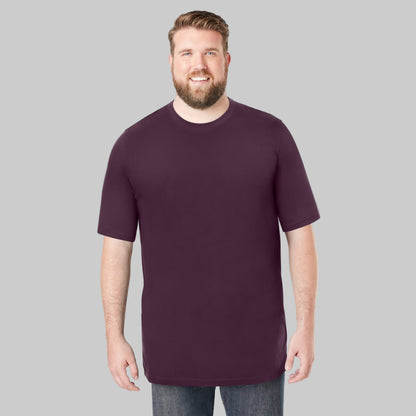 Plus-size male model wearing deep purple heavyweight crewneck T-shirt, relaxed fit, front view, studio background.