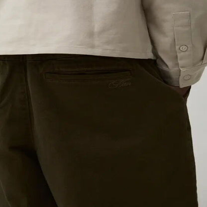 Men’s deep olive wide-leg pants with relaxed fit and clean design