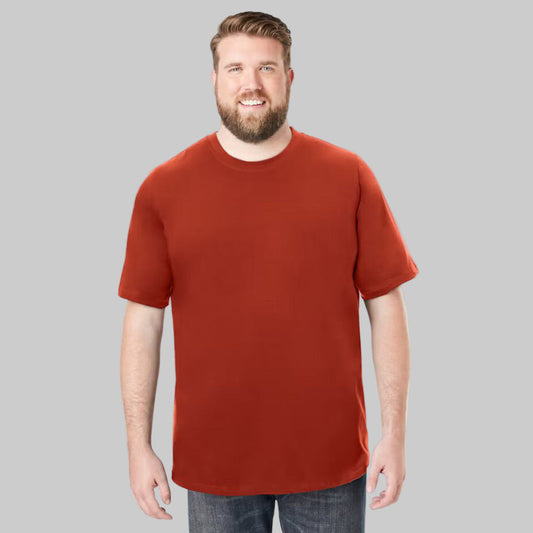 Plus-size Pakistani male model wearing desert red heavyweight crewneck T-shirt on a clean studio background.
