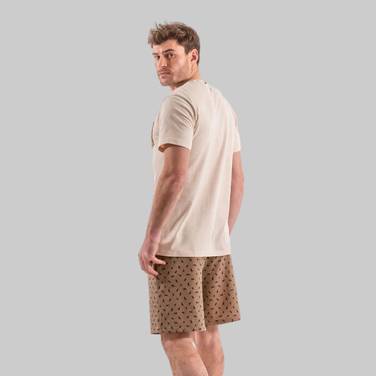 Man wearing a Desert Beige Big & Tall printed pocket crewneck T-shirt with matching printed lounge shorts.